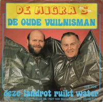 Migra's - De oude vuilnisman + Deze landrot ruikt water (Vinylsingle)